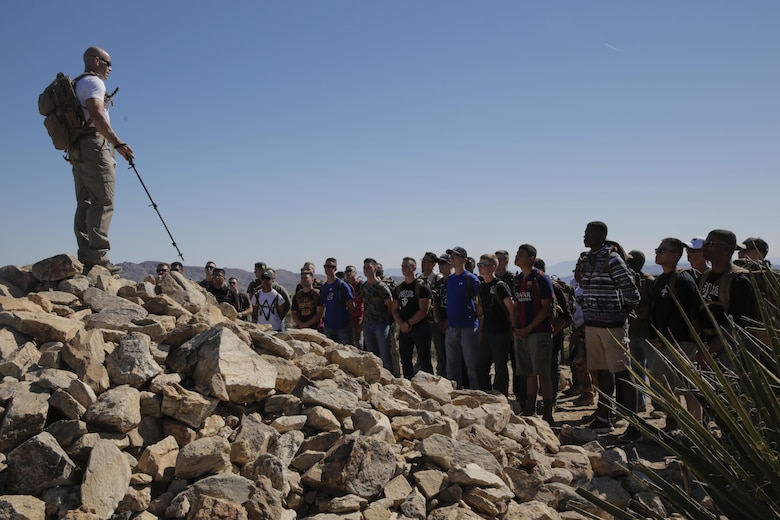 1st Sgt. Ryan Cantrell, Company B First Sergeant, Marine Corps Communication-Electronics School, speaks to Marines in the Round Table Mentorship Program on top of Ryan Mountain in Joshua Tree National Park, Calif., May 12, 2017. Round Table is a mentorship program created by MCCES to break down walls between leadership and junior Marines by encouraging open dialogue and develop professional relationships across the ranks. (U.S. Marine Corps photo by Cpl. Dave Flores)