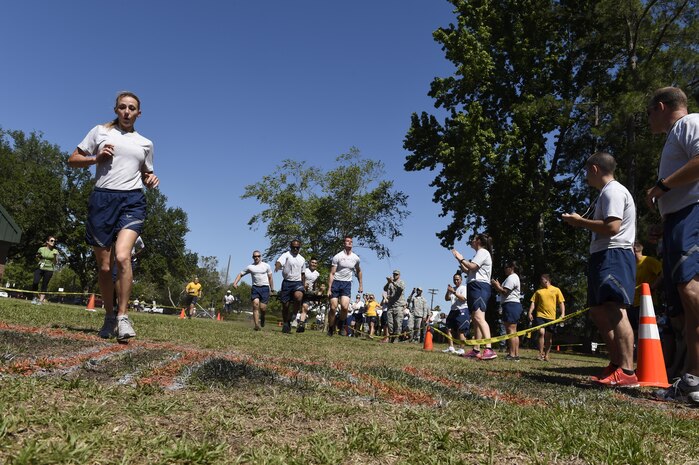 Members of Team Charleston carry a litter with a 180 pound mannequin during a race at the Lowcountry Medical Skills Expo here, May 17, 2017. Nearly 300 people from eight agencies trained on nine medical competencies including sutures, mass blood transfusions, IVs and litter carrying techniques with 180 pound mannequins during the expo.