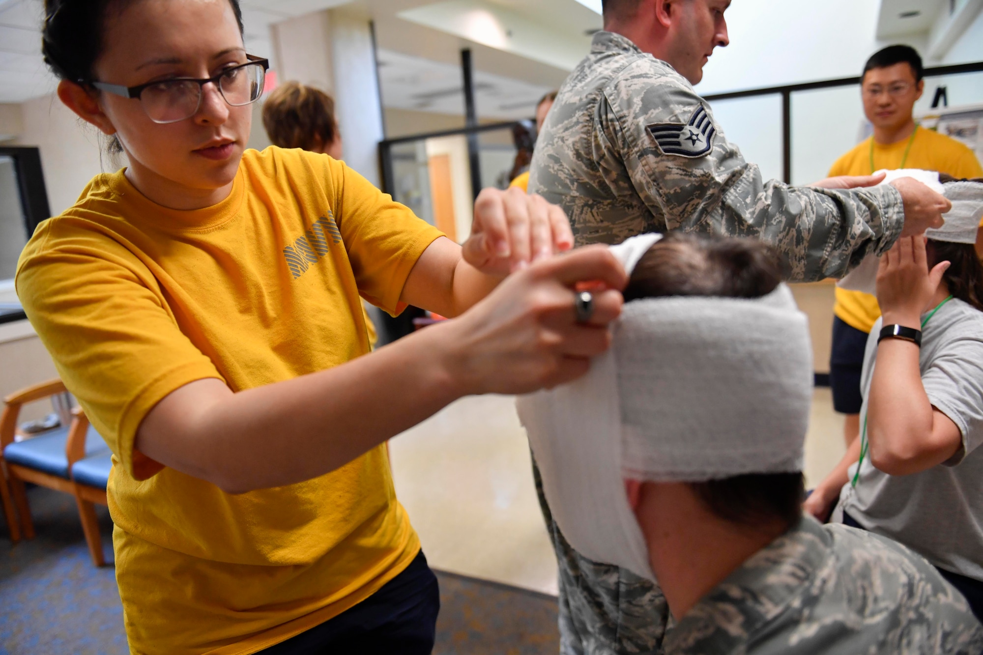 U.S. Navy Seaman Apprentice Katharine Soliz, Naval Health Clinic Charleston general duty corpsman, learns how to stabilize a broken jaw during the second annual Lowcountry Medical Skills Expo here, May 17, 2017. Nearly 300 people from eight agencies trained on nine medical competencies including sutures, mass blood transfusions, IVs and litter carrying techniques during the expo.