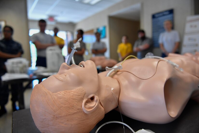 Members of Team Charleston learn about medical tubes during the second annual Lowcountry Medical Skills Expo here, May 17, 2017. Nearly 300 people from eight agencies trained on nine medical competencies including sutures, mass blood transfusions, IVs and litter carrying techniques during the expo.