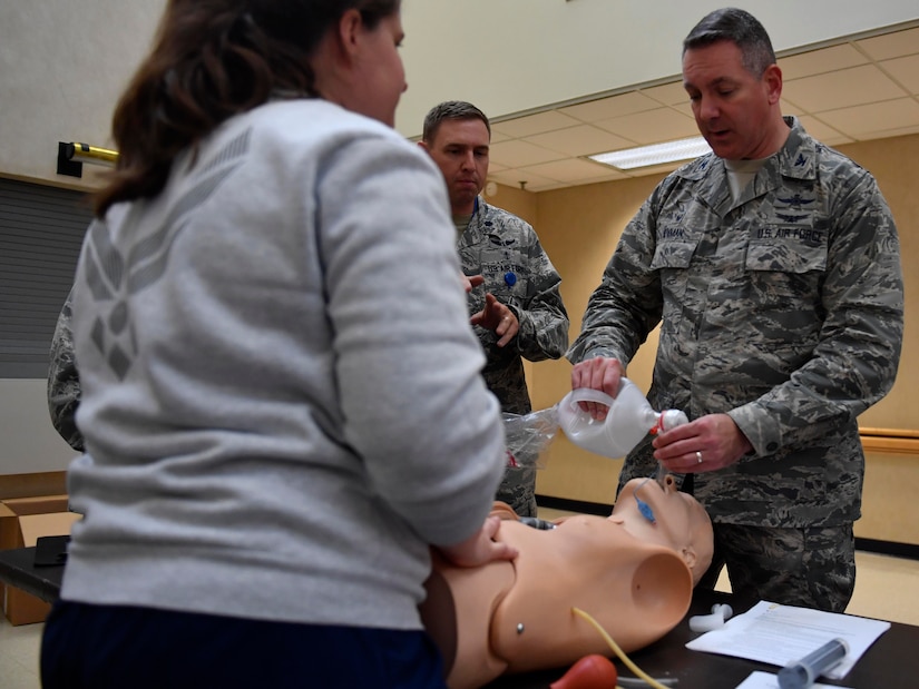 U.S. Air Force Col. Robert Lyman, left, Joint Base Charleston commander, learns assisted breathing techniques during the second annual Lowcountry Medical Skills Expo here, May 17, 2017. Nearly 300 people from eight agencies trained on nine medical competencies including sutures, mass blood transfusions, IVs and litter carrying techniques with during the expo.