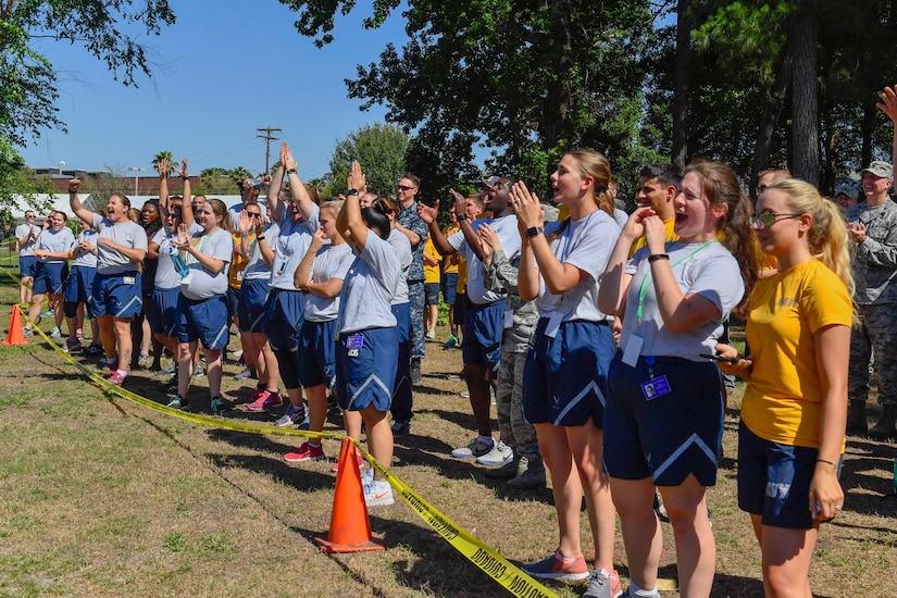 Airmen and Sailors cheer as teams participate in an Olympic-style completion between the 628th Medical Group and Naval Health Clinic Charleston as part of the second annual Lowcountry Skills Expo is announced here, May 17, 2017. Two teams from each unit raced to finish medical and physical tasks including hemorrhage control, triage, push-ups, squats and a stretcher carry to the finish line. The 628th MDG won the Lowcountry Medical Skills Expo trophy for the second year in a row.