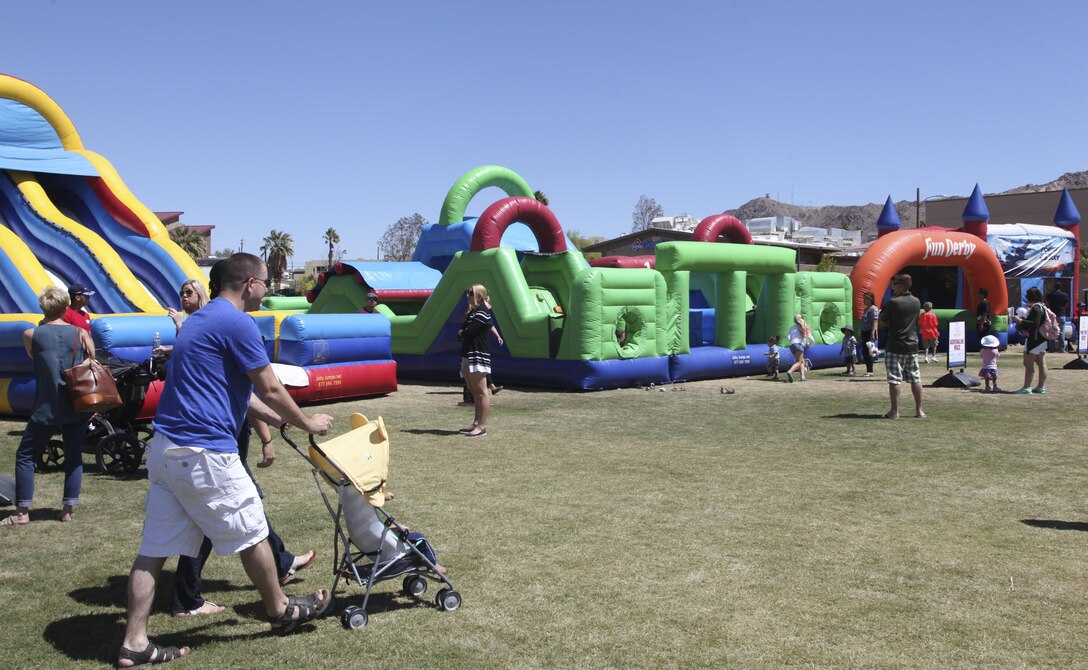 Combat Center patrons enjoy bounce houses during the annual We Salute You Fest at Victory Field aboard the Marine Corps Air Ground Combat Center, Twentynine Palms, Calif., Saturday. Marine Corps Community Services hosts the event to show their appreciation for all the hard working service members who protect this country.