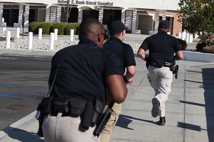 Officers from the Provost Marshal’s Office respond to gun fire in the Naval Hospital Twentynine Palms during an Active Shooter Exercise, May 16, 2017. The exercise allowed for the naval hospital, Provost Marshals Office, Fire Department and Naval Criminal Investigative Service to practice and assess their ability to detect, identify and respond to an active shooter incident, validating emergency response procedures. (U.S. Marine Corps photo by Cpl. Thomas Mudd)