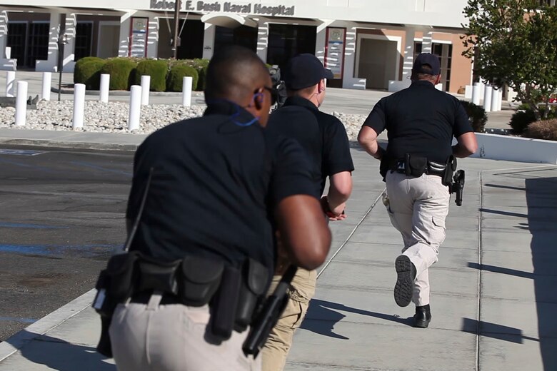Officers from the Provost Marshal’s Office respond to gun fire in the Naval Hospital Twentynine Palms during an Active Shooter Exercise, May 16, 2017. The exercise allowed for the naval hospital, Provost Marshals Office, Fire Department and Naval Criminal Investigative Service to practice and assess their ability to detect, identify and respond to an active shooter incident, validating emergency response procedures. (U.S. Marine Corps photo by Cpl. Thomas Mudd)