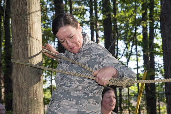 Commissioned Officer Training students balances across a rope obstacle at the Officer Training School’s Vigilant Warrior training site, April 25, 2017, near Titus, Ala. Vigilant Warrior is a 200 acre expeditionary training site. (U.S. Air Force photo/ Senior Airman Alexa Culbert)