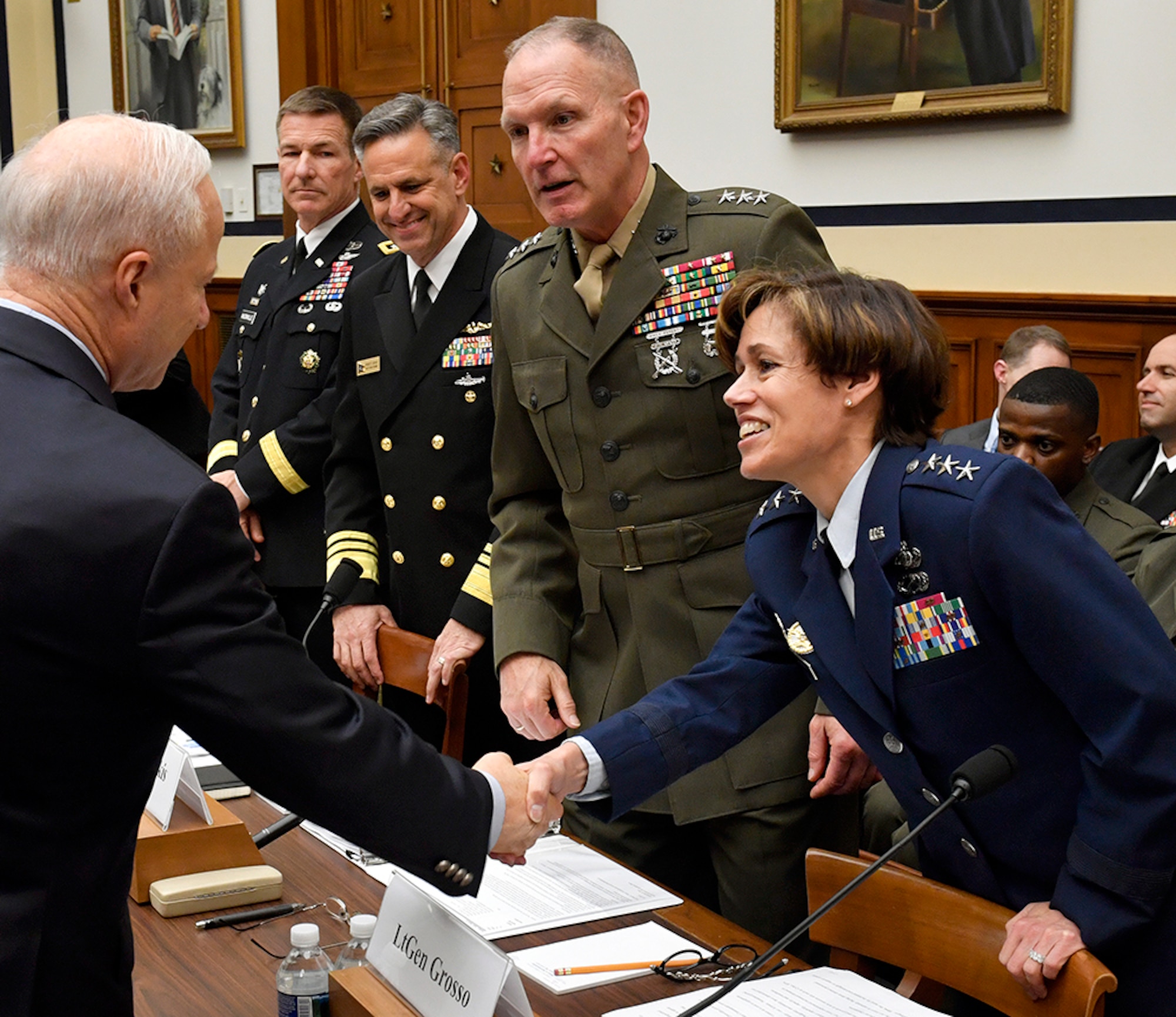 Lt. Gen. Gina Grosso, the Air Force deputy chief of staff for manpower and personnel service greets Rep. Michael Coffman, R-Colo., the chairman of the Military Personnel Subcommittee before testifying on military personnel posture May 17, 2017, in Washington, D.C. Grosso testified with Marine Corps Lt. Gen. Mark Brilakis, the U.S. Marine Corps deputy commandant for manpower and reserve affairs; Navy Vice Adm. Robert Burke, the U.S. Navy Chief of naval personnel; and Army Maj. Gen. Erik Peterson, the U.S. Army director of Army aviation. (U.S. Air Force photo/Wayne A. Clark)