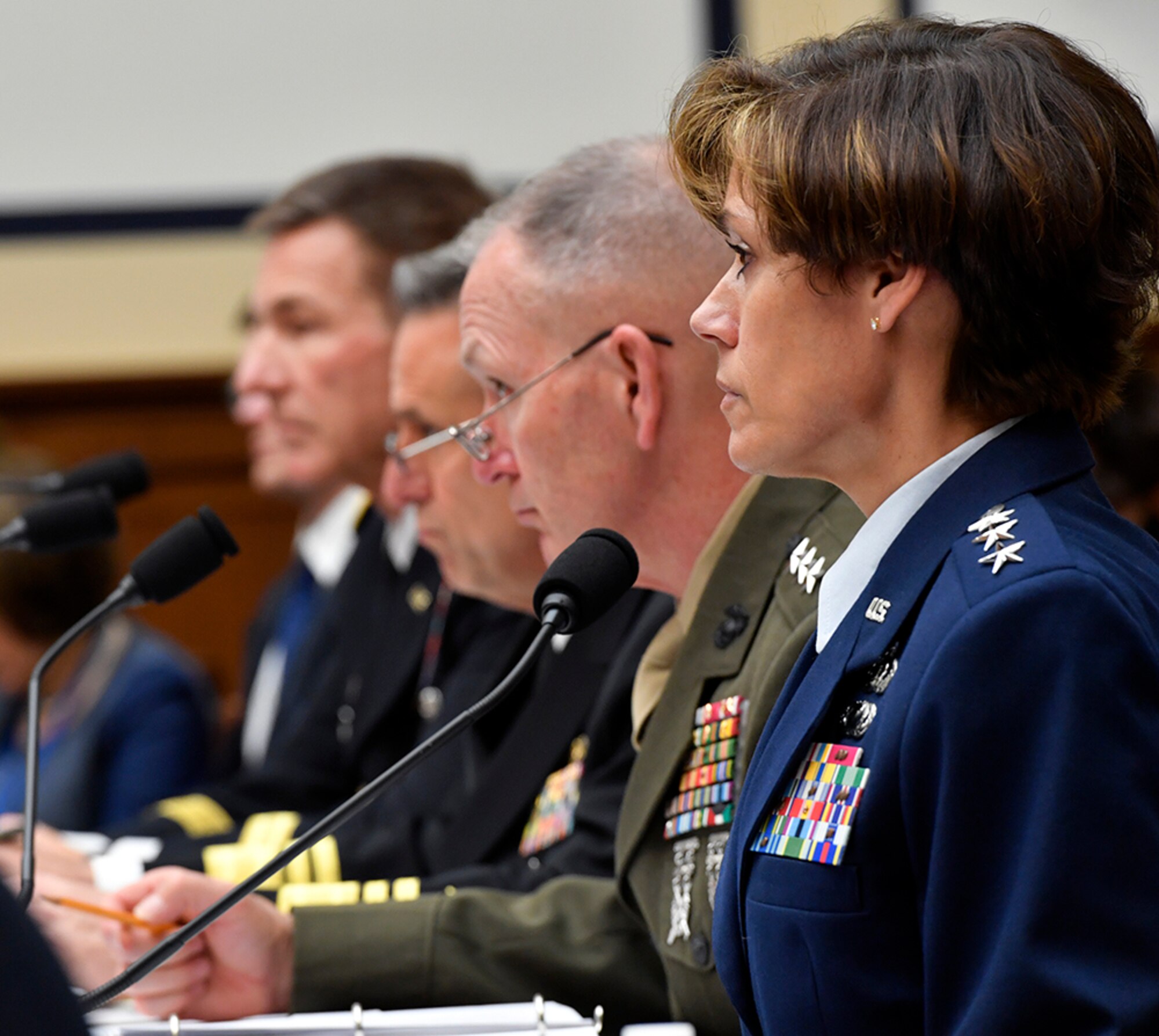 Lt. Gen. Gina Grosso, the Air Force deputy chief of staff for manpower and personnel service greets Mike Coffman, the chairman of the Military Personnel Subcommittee before testifying on military personnel posture May 17, 2017, in Washington, D.C. Grosso testified with Marine Corps Lt. Gen. Mark Brilakis, the U.S. Marine Corps deputy commandant for manpower and reserve Affairs; Navy Vice Adm. Robert Burke, the U.S. Navy Chief of naval personnel; and Army Maj. Gen. Erik Peterson, the U.S. Army director of Army aviation. (U.S. Air Force photo/Wayne A. Clark)