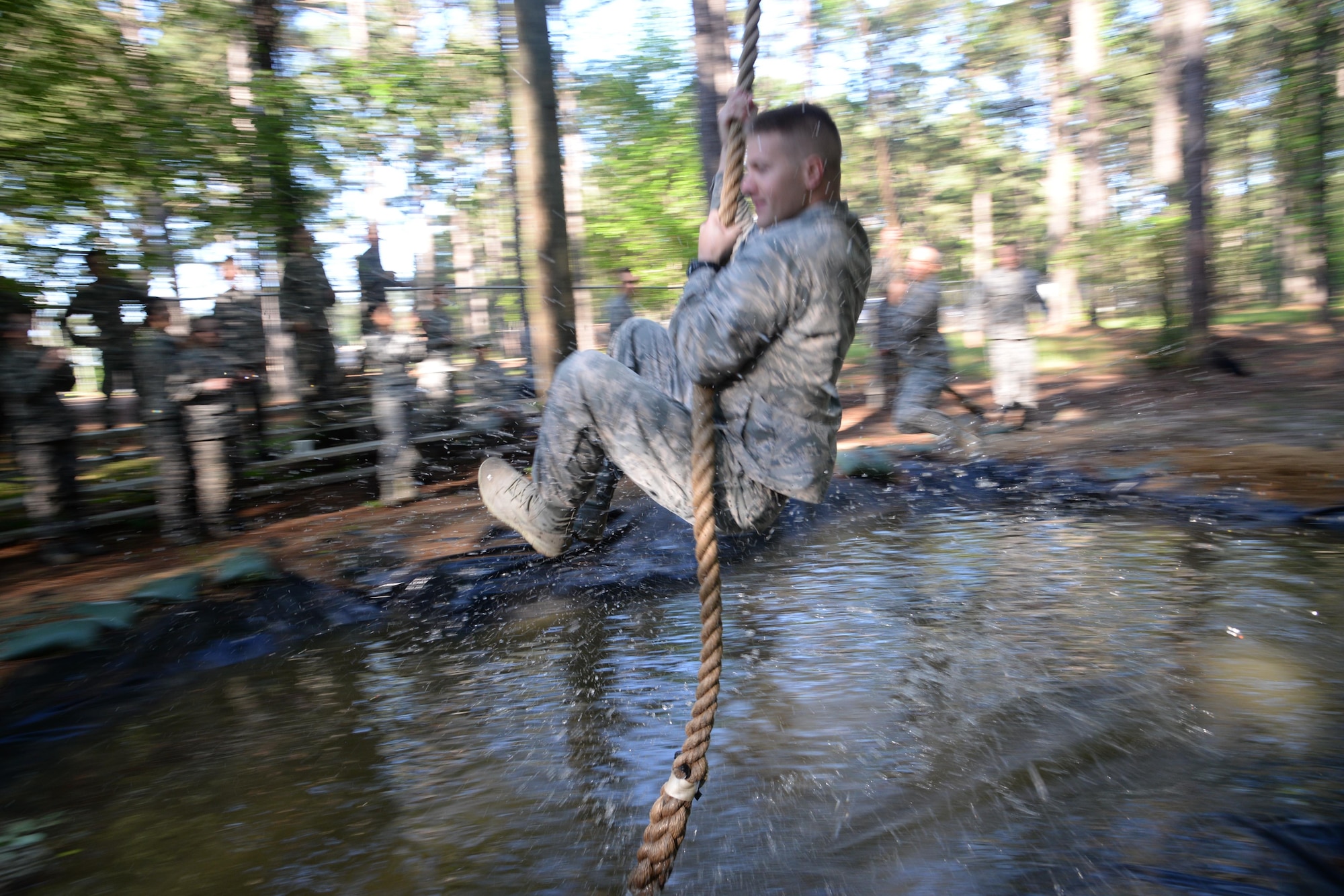 Commissioned Officer Training student swings across the last obstacle of the Officer Training School’s Vigilant Warrior training site, April 25, 2017, Maxwell Air Force Base, Ala. Unlike Total Force Officer Training cadets, COT students enter training with officer rank and are recruited to serve in specialized career fields. (U.S. Air Force photo/ Senior Airman Alexa Culbert)