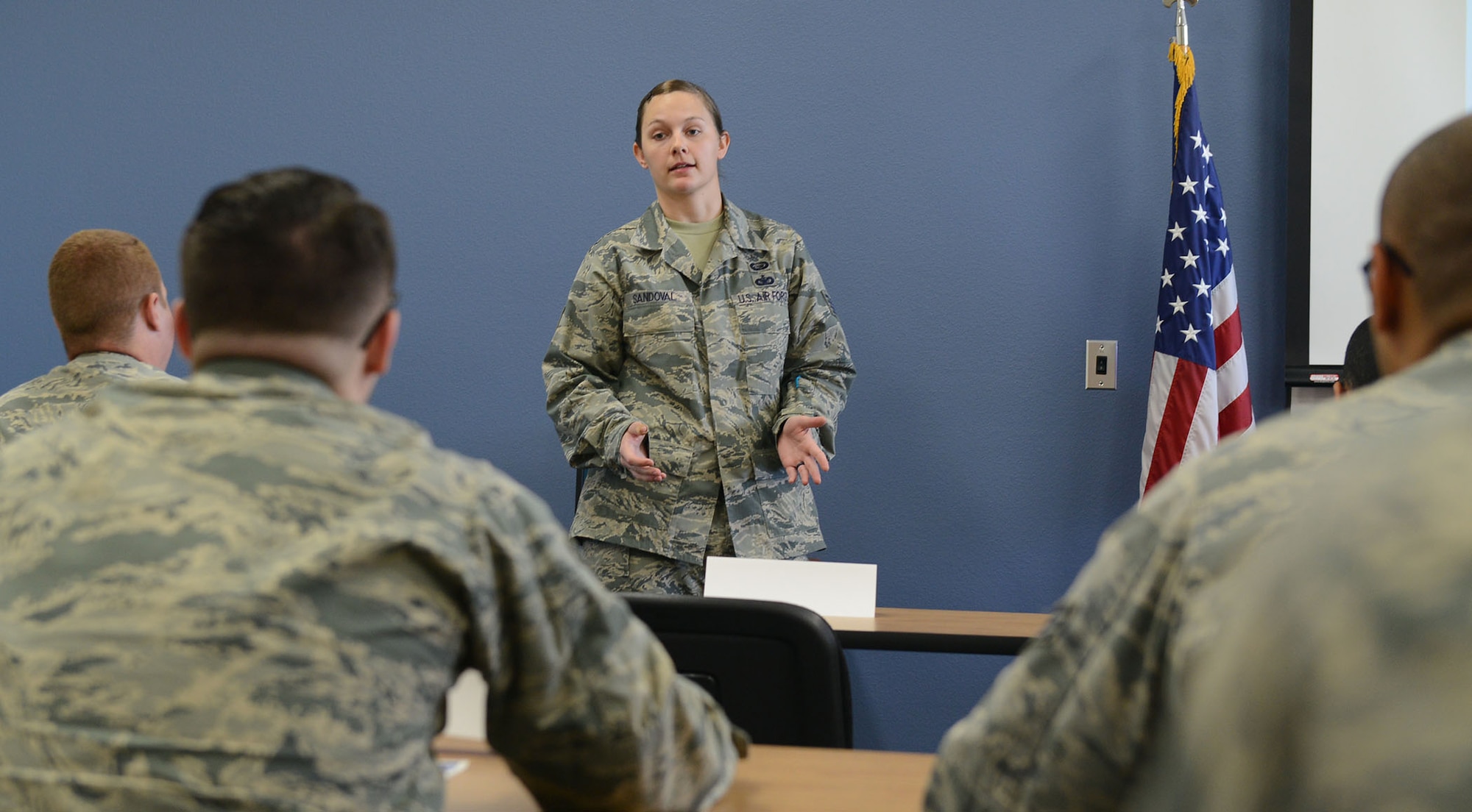 Staff Sgt. Destiny Sandoval, 56th Maintenance Group unit training manager, briefs Airmen on education and training during the Airmen Professional Enhancement Course May 18, 2017, at Luke Air Force Base, Ariz. AMNPEC features various briefings and panels to develop senior airmen and airmen first class as better leaders and followers. (U.S. Air Force photo by Senior Airman James Hensley)