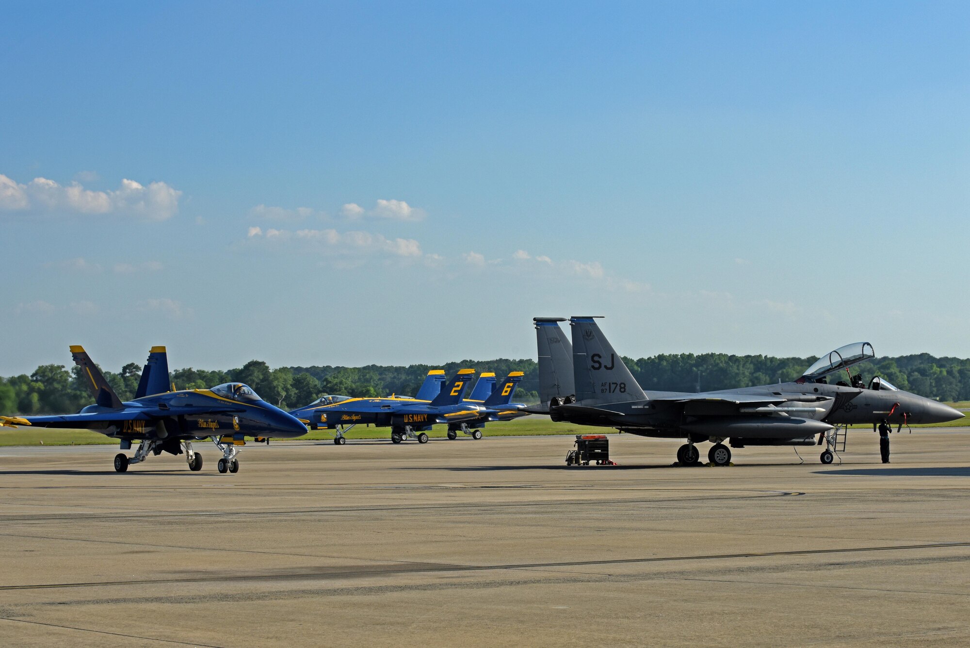 The U.S. Navy Blue Angels F/A-18 Hornets taxi after landing, May 17, 2017, at Seymour Johnson Air Force Base, North Carolina. The Blue Angels pilots will perform aerial stunts and routines during the Wings Over Wayne Air Show, May 20- 21. (U.S. Air Force photo by Senior Airman Ashley Maldonado)