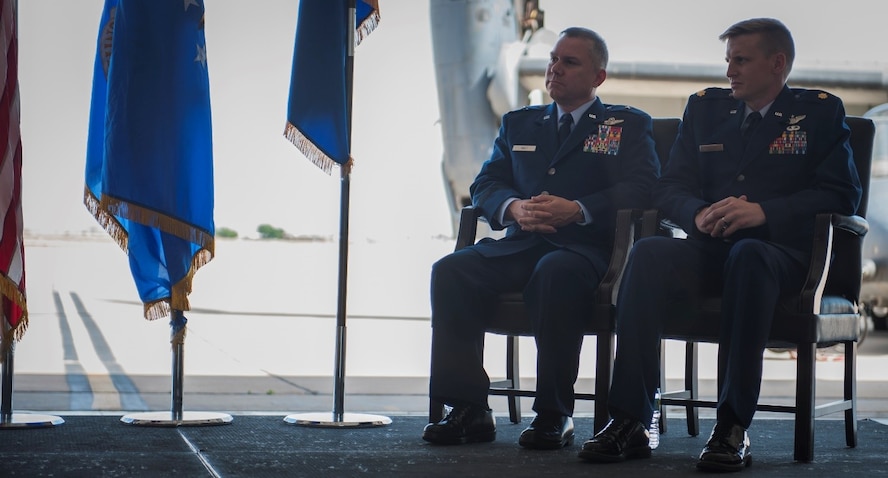 Maj. William Mendel, 20th Special Operations Squadron, sits next to Brig. Gen. William Holt, Air Force Special Operations Command director of operations, Hurlburt Field, Fla., during his Distinguished Flying Cross ceremony at Cannon Air Force Base, N.M., May 15, 2017. Maj. Mendel and other aircraft in his formation received heavy and effective hostile fire during a mission in Africa, but managed to save the lives of four critically wounded individuals and complete the mission. He and other crew members were presented the Distinguished Flying Cross, a medal created in 1918 to reward those who display heroism or extraordinary achievement while participating in an aerial flight. Maj. Mendel became the 79th Airman under Air Force Special Operations Command to receive the honor. (U.S. Air Force photo by Senior Airman Lane T. Plummer)