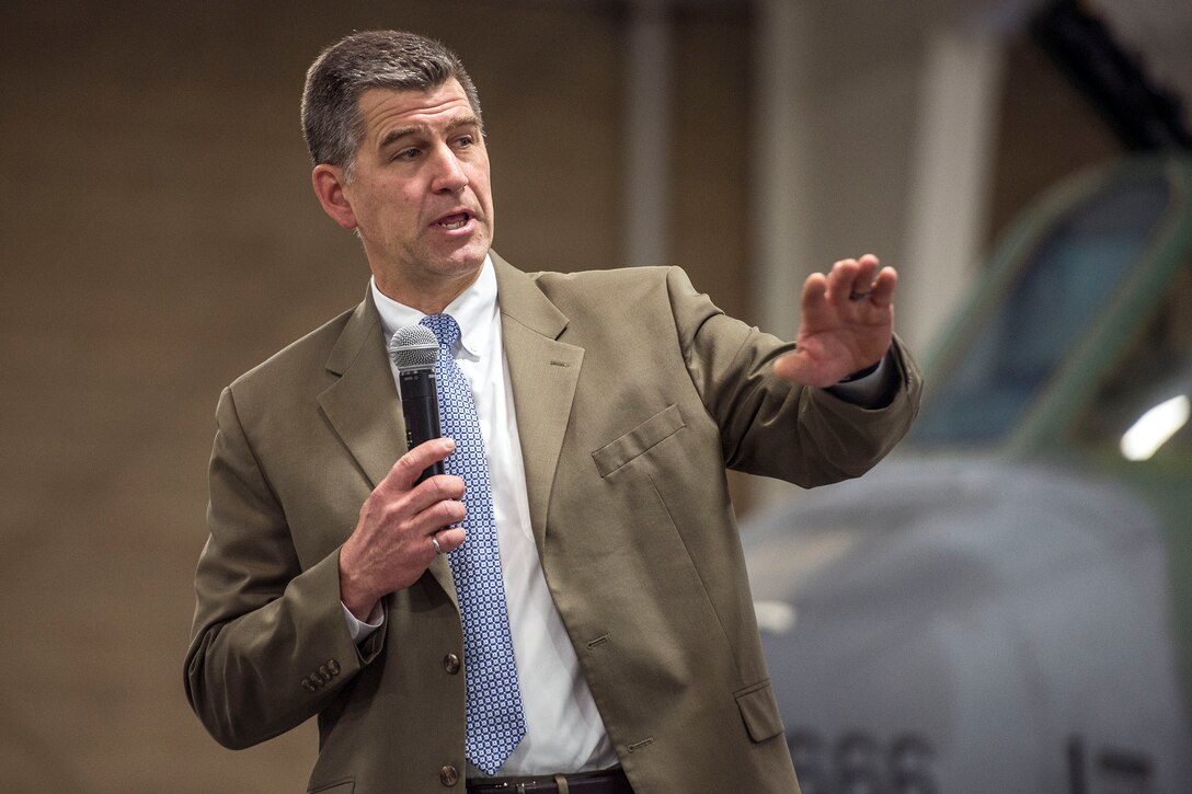 Materials and Manufacturing Directorate Chief Engineer Dr. Larry Butkus, Air Force Research Laboratory, Wright-Patterson Air Force Base, Ohio, speaks during the 14th annual Science, Engineering and Technical Management awards ceremony May 9 at Hill Air Force Base, Utah. Dr. Butkus spoke about short- and long-term technological developments, saying these innovations would not be possible without input, interaction and collaboration from Hill AFB employees. “I encourage you to continue to work with us as we advance technology for our Airmen, for our weapons systems, and for our nation follow,” he said. (U.S. Air Force/Paul Holcomb)