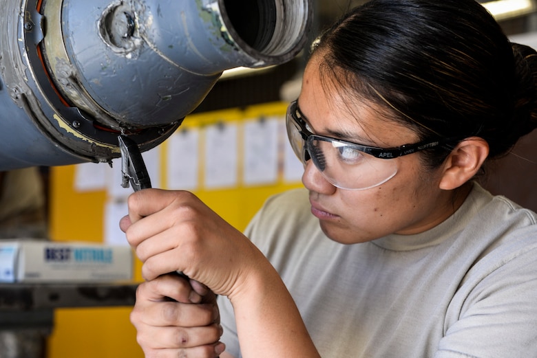 Airman 1st Class Korie Morimoto, 823rd Maintenance Squadron aircraft fuel systems apprentice, performs maintenance on an HH-60G Pave Hawk helicopter fuel probe at Nellis Air Force Base, Nev., May 4, 2017. The 823rd MXS was tasked with rebuilding the HH-60’s fuel probe to prevent leaks during in-flight refueling. (U.S. Air Force photo by Airman 1st Class Andrew D. Sarver/Released)