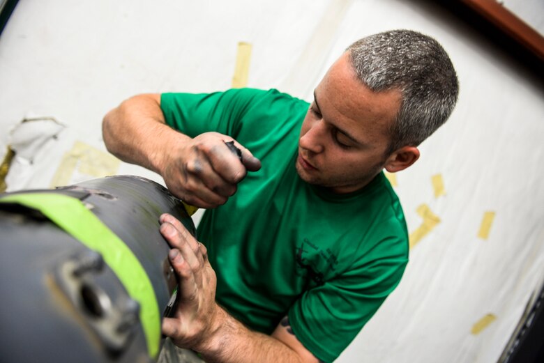 Staff Sgt. Lance Cissell, 823rd Maintenance Squadron aircraft fuel systems craftsman, strips off old adhesive during an HH-60G Pave Hawk fuel probe repair at Nellis Air Force Base, Nev., May 5, 2017. The probe rebuild consisted of disassembling and replacing the adhesive around each tube to prevent leaks during in-fight refueling. (U.S. Air Force photo by Airman 1st Class Andrew D. Sarver/Released)