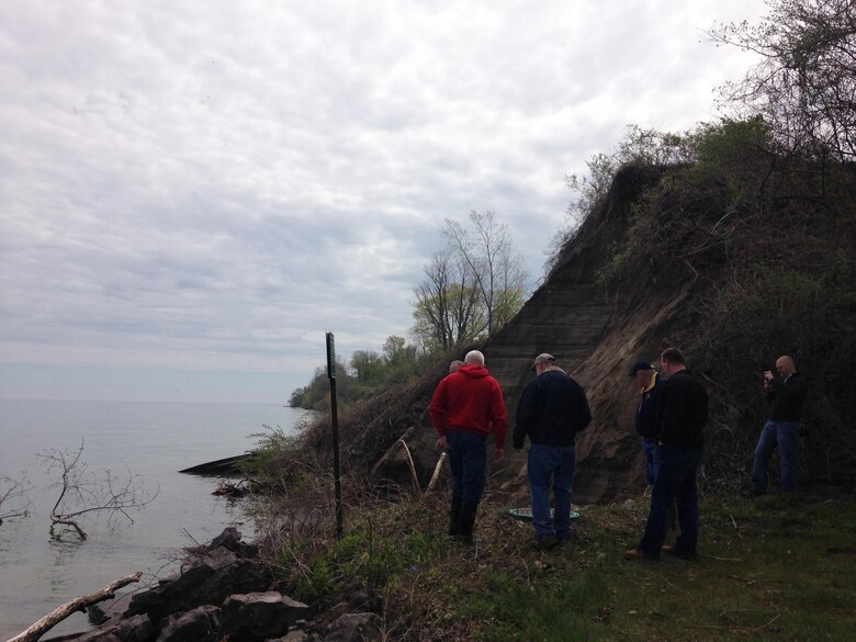 A Sodus, New York bluff was hit with severe erosion due to high Lake Ontario water levels and the town placed small stones and broken concrete to try and support the area.  A U.S. Army Corps of Engineers Buffalo District Technical Assistance Field Team recommended short term fixes of placing geotextile material, larger stones and creating gentler slopes.