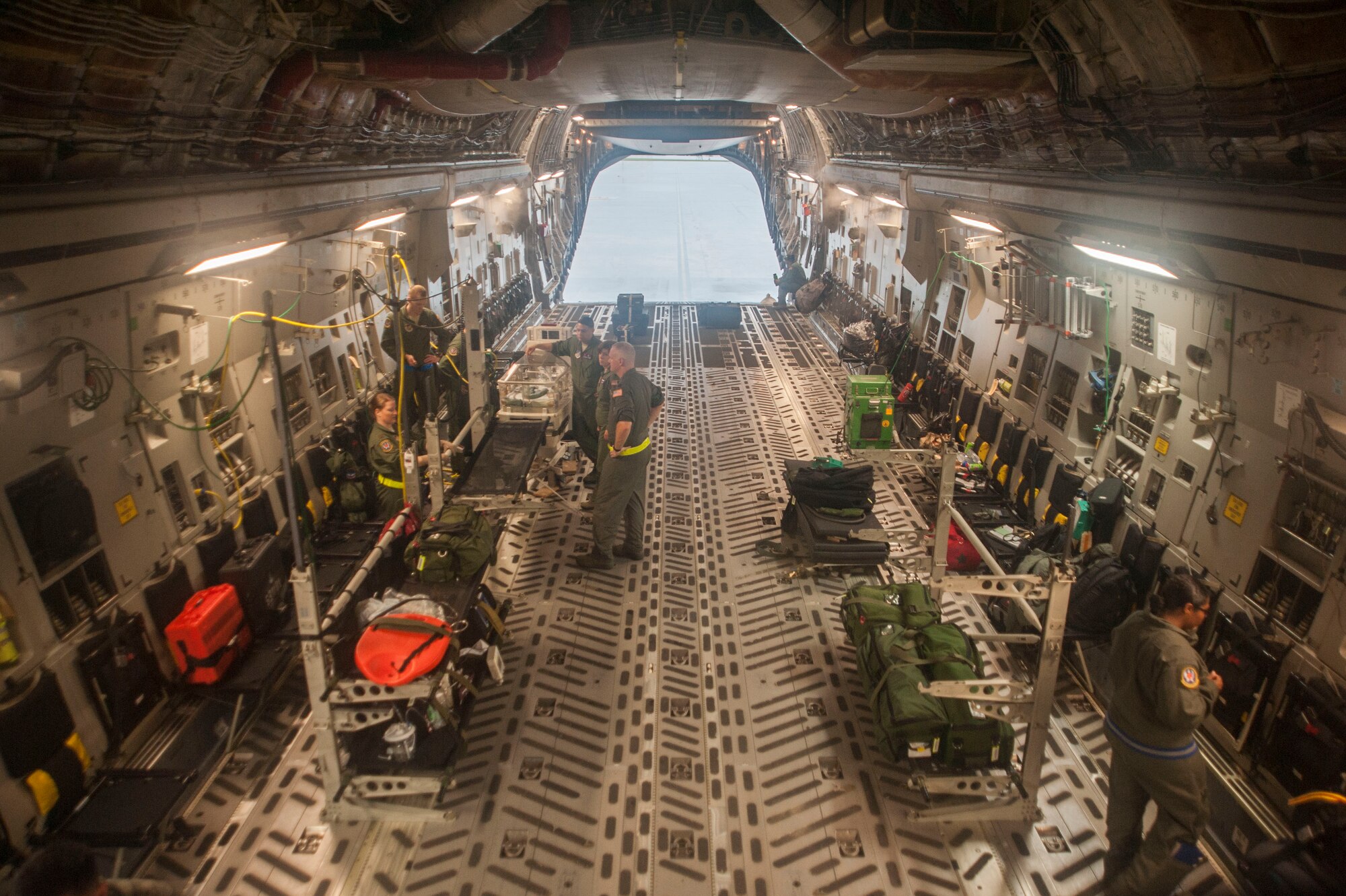 U.S. Air Force Airmen from the 18th Aerospace Evacuation Squadron work to secure medical equipment in a C-17 Globemaster III May 13, 2017, at Kadena Air Base, Japan. Airmen from the 18th AES worked with U.S. Navy Sailors to outfit a “Giraffe” omnibed system into a C-17 Globemaster III for the first time. (U.S. Air Force photo by Senior Airman Quay Drawdy)
