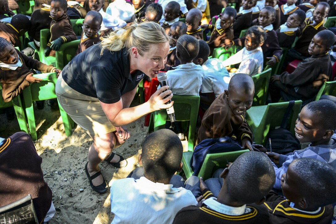 Air Force Staff Sgt. Jill Diem, a vocalist with the U.S. Air Forces in Europe Band’s “Ambassadors Combo,” performs for Kachikau Primary School students in Kachikau, Botswana, May 17, 2017, while supporting the 2017 African Air Chiefs Symposium. Air Force photo by Staff Sgt. Krystal Ardrey