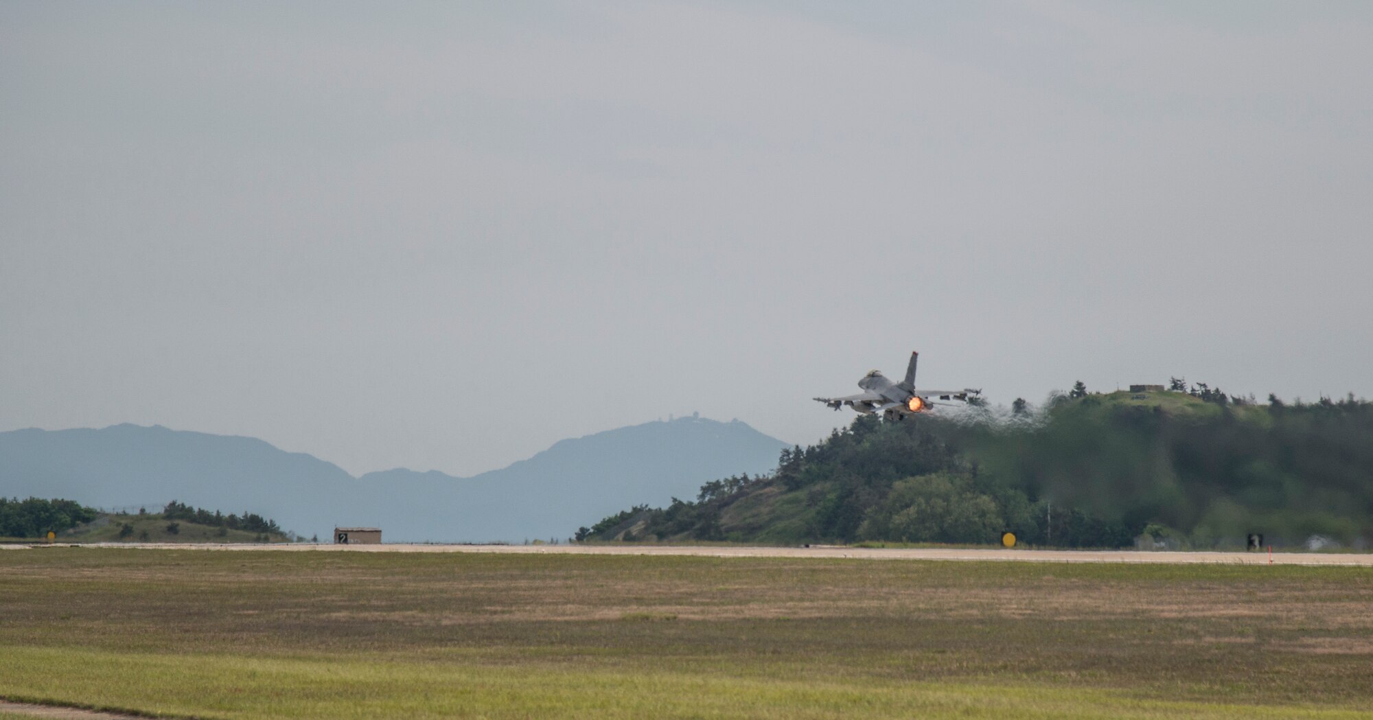 A F-16 Fighting Falcon with the 14th Fighter Squadron takes-off at Kunsan Air Base, Republic of Korea, May 16, 2017. Due to routine flight line maintenance at Misawa Air Base, Japan, the 14th FS relocated to Kunsan AB, integrating operations with the 80th FS. By relocating to other bases, maintenance teams and pilots can continue training with allies and partners by conducting day-to-day operations until runway maintenance at Misawa AB is completed. (U.S. Air Force photo by Senior Airman Brittany A. Chase)
