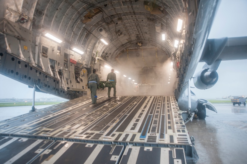 U.S. Air Force Airmen assigned to the 18th Aerospace Evacuation Squadron load equipment into a C-17 Globemaster III at Kadena Air Base, Japan, May 13, 2017. (U.S. Air Force photo by Senior Airman Quay Drawdy)