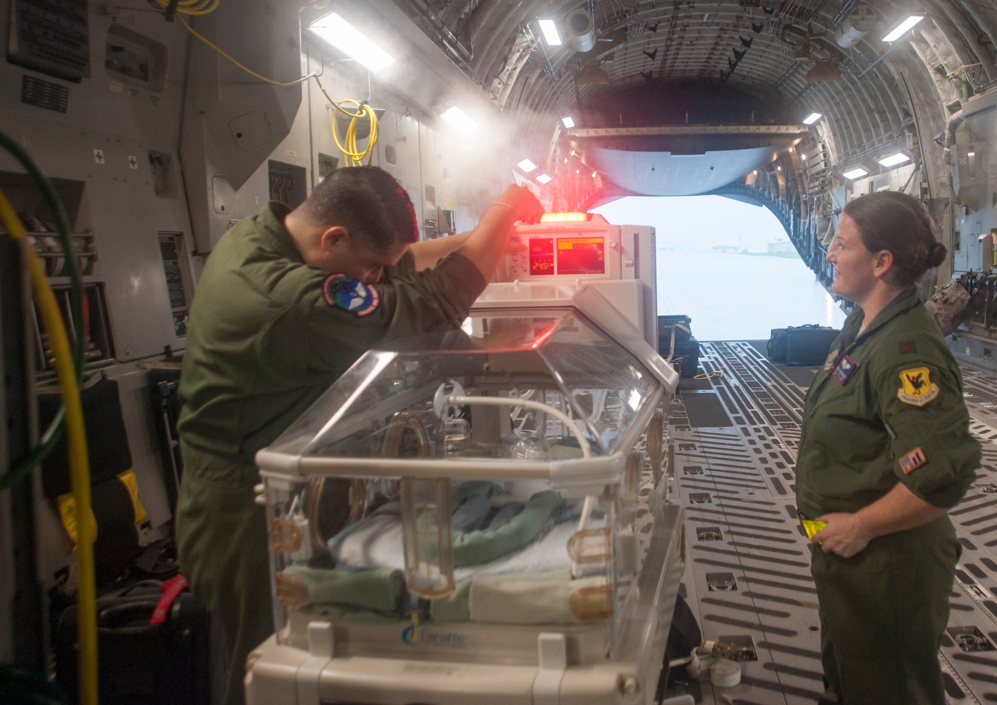 U.S. Air Force Staff Sgt. Angel Figueroa, 18th Medical Operations Squadron technician (left), and Maj. Melissa Dassinger, 18th Aerospace Evacuation Squadron (AES) Training Flight commander, test a “Giraffe” omnibed at Kadena Air Base, Japan, May 13, 2017. (U.S. Air Force photo by Senior Airman Quay Drawdy)