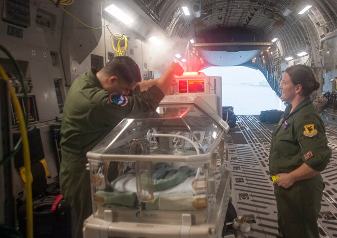 U.S. Air Force Staff Sgt. Angel Figueroa, 18th Medical Operations Squadron technician (left), and Maj. Melissa Dassinger, 18th Aerospace Evacuation Squadron (AES) Training Flight commander, test a “Giraffe” omnibed at Kadena Air Base, Japan, May 13, 2017. (U.S. Air Force photo by Senior Airman Quay Drawdy)