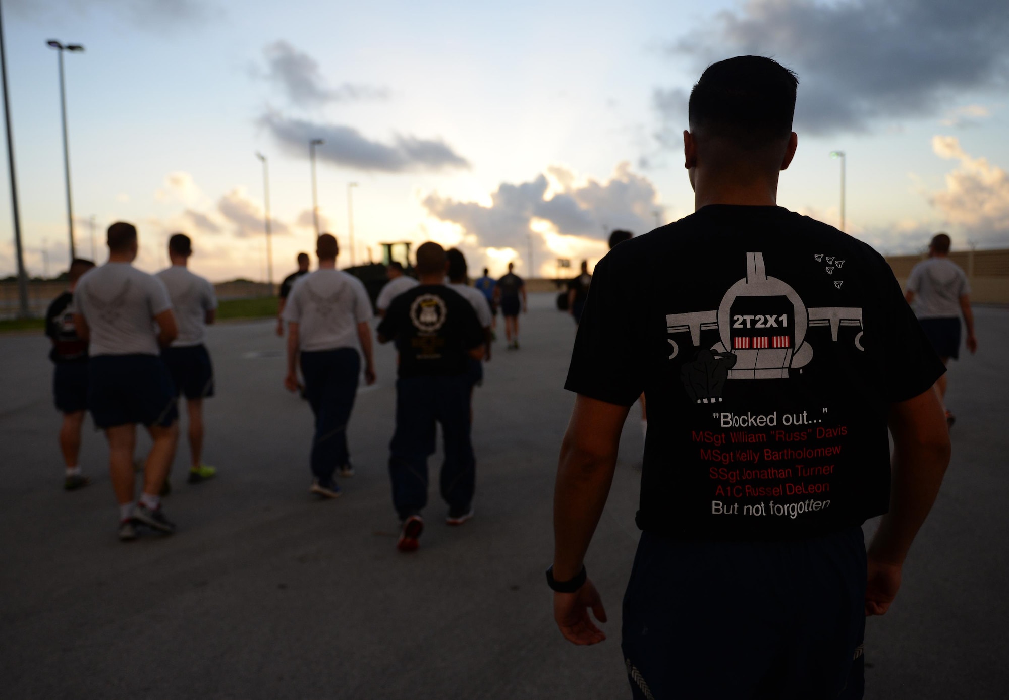 Airmen with the 734th Air Mobility Squadron and 44th Aerial Port Squadron participate in Port Dawg memorial to commemorate fallen air transportation specialists May 19, 2017, at Andersen Air Force Base, Guam.  Aerial porters, commonly referred to as Port Dawgs, are responsible for military logistics related to aerial ports and come from multiple units on Andersen AFB to include the 734th AMS, 36th Contingency Response Group and 36th Mission Readiness Squadron. (U.S. Air Force photo by Senior Airman Alexa Ann Henderson)