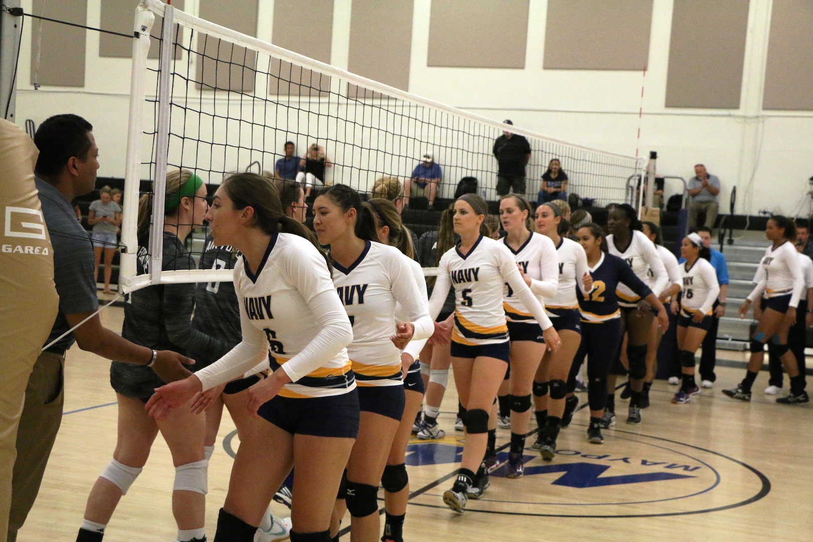 Navy wins match 1 over Air Force of the 2017 Armed Forces Women's Volleyball Championship at Naval Station Mayport, Florida on 18 May.