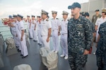 170518-N-PD309-041 CHANGI NAVAL BASE, Singapore (May 18, 2017) Sailors assigned to littoral combat ship USS Coronado (LCS 4) stand at attention aboard Japanese Maritime Self Defense Force ship JS Izumo (DDH 183) during morning colors prior to the ships getting underway to execute a bilateral passing exercise at sea. Coronado is on a rotational deployment in U.S. 7th Fleet area of responsibility, patrolling the region's littorals and working hull-to-hull with partner navies to provide 7th Fleet with the flexible capabilities it needs now and in the future. (U.S. Navy photo by Mass Communication Specialist 3rd Class Deven Leigh Ellis/Released)