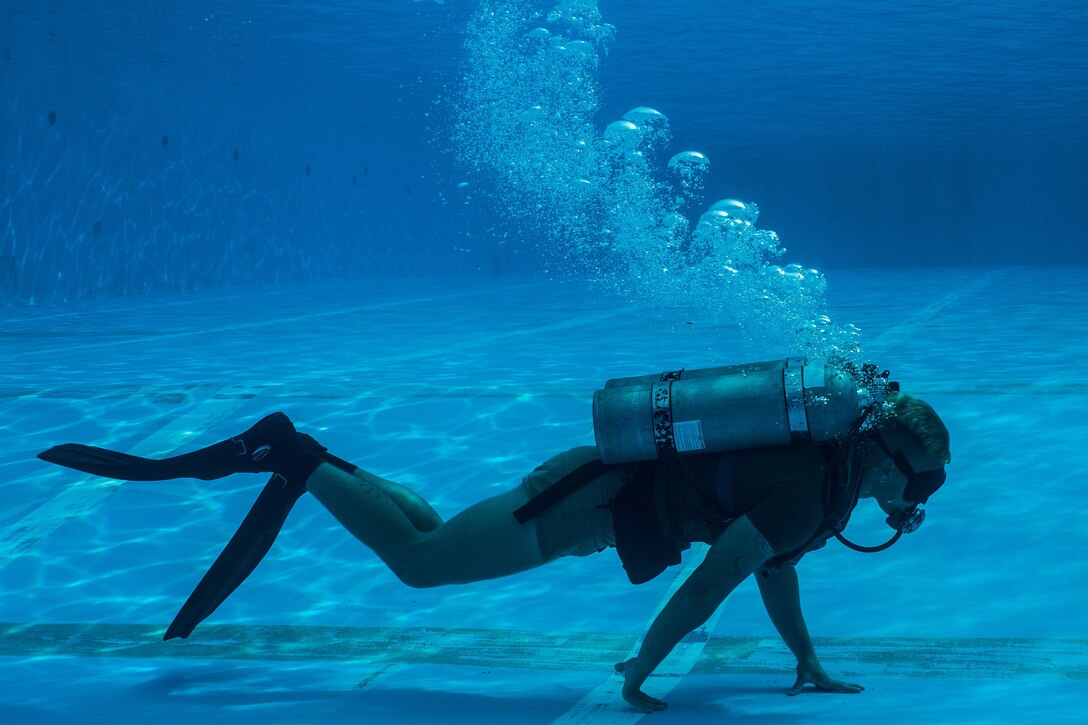 A reconnaissance Marine participates in the United States Marine Corps Combatant Divers Course, on Camp Schwab, Okinawa, Japan, May 11, 2017. A mobile training team from Navy Diving and Salvage Training Center, Panama City, Florida, conducted the training. The USMC Combatant Divers Course is eight weeks and combines lectures, demonstrations and practical application of circuit diving, diving physics, and medical aid. The Marine is with 3rd Reconnaissance Battalion, 3rd Marine Division, III Marine Expeditionary Force. (U.S. Marine Corps photo by Sgt. Isaac Ibarra)
