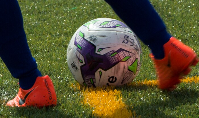 A player with the Christian Academy in Japan girls soccer team prepares to kick the ball during the 2017 Girls Division II Far East Soccer Tournament at Marine Corps Air Station Iwakuni, Japan, May 15, 2017. International and Department of Defense Education Activity high school teams from all over Japan made up the four-day, 32-game tournament with Matthew C. Perry’s Lady Samurai soccer team winning the championship match 2-0. (U.S. Marine Corps photo by Pfc. Stephen Campbell)