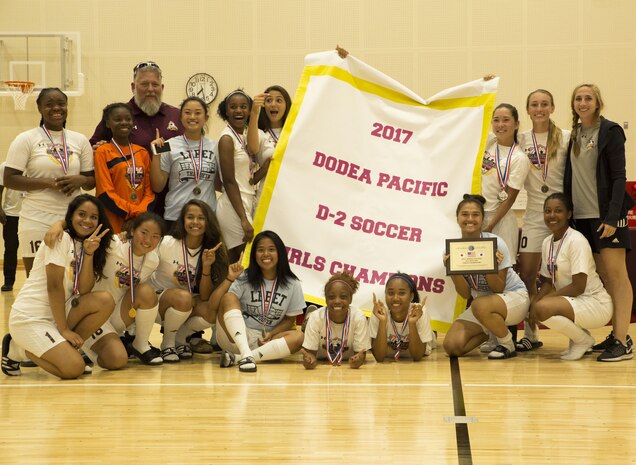 The Matthew C. Perry’s Lady Samurai soccer team poses for a photo after winning the 2017 Girls Division II Far East Soccer Tournament at Marine Corps Air Station Iwakuni, Japan, May 18, 2017. International and Department of Defense Education Activity high school teams from all over Japan made up the four-day, 32-game tournament with M.C. Perry winning the championship against the International School of the Sacred Heart 2-0. (U.S. Marine Corps photo by Pfc. Stephen Campbell)