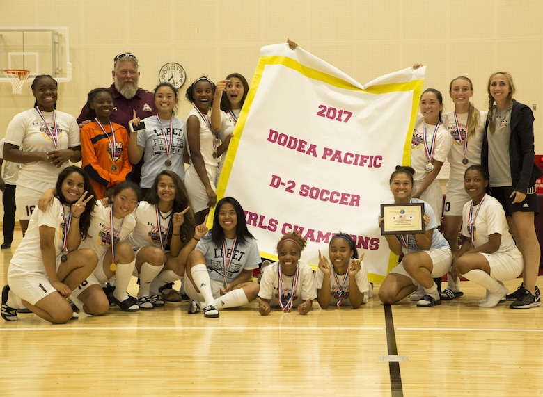The Matthew C. Perry’s Lady Samurai soccer team poses for a photo after winning the 2017 Girls Division II Far East Soccer Tournament at Marine Corps Air Station Iwakuni, Japan, May 18, 2017. International and Department of Defense Education Activity high school teams from all over Japan made up the four-day, 32-game tournament with M.C. Perry winning the championship against the International School of the Sacred Heart 2-0. (U.S. Marine Corps photo by Pfc. Stephen Campbell)
