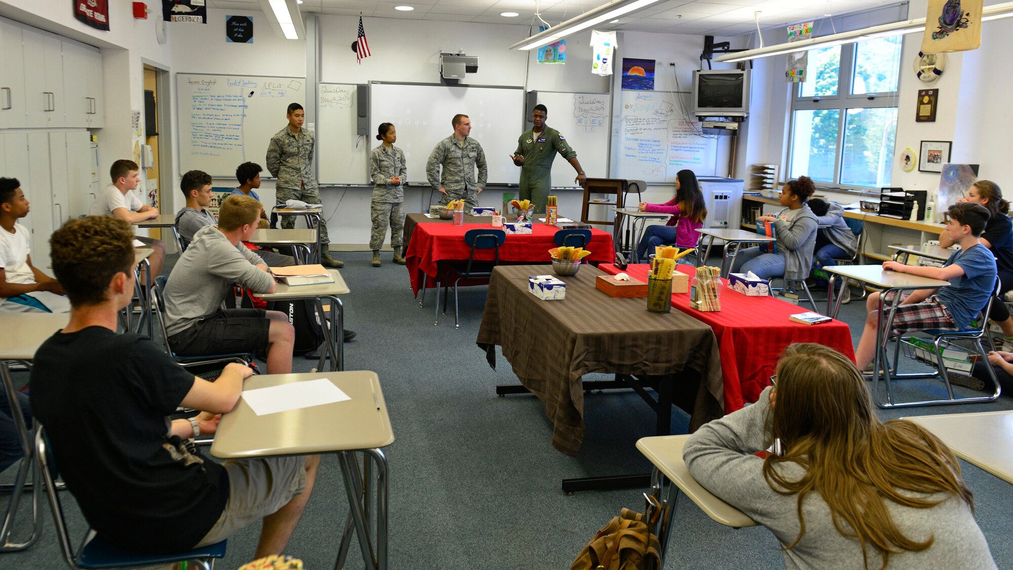 Air Force officers talk with high school students during career day, May 16, 2017, at Aviano Air Base, Italy. Officer and enlisted personnel from 14 careers fields talked with students about their career fields which included medicine, law, civil engineering, and aviation. (U.S. Air Force photo by Senior Airman Cary Smith)