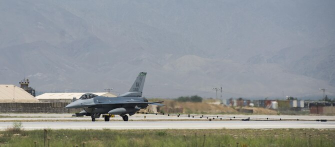 An F-16 Fighting Falcon from the 555th Expeditionary Fighter Squadron engages a barrier during a certification of the mobile aircraft arresting system at Bagram Airfield, Afghanistan, May 19, 2017. The barrier system is used in case of an emergency when a pilot cannot stop their aircraft. (U.S. Air Force photo by Staff Sgt. Benjamin Gonsier)