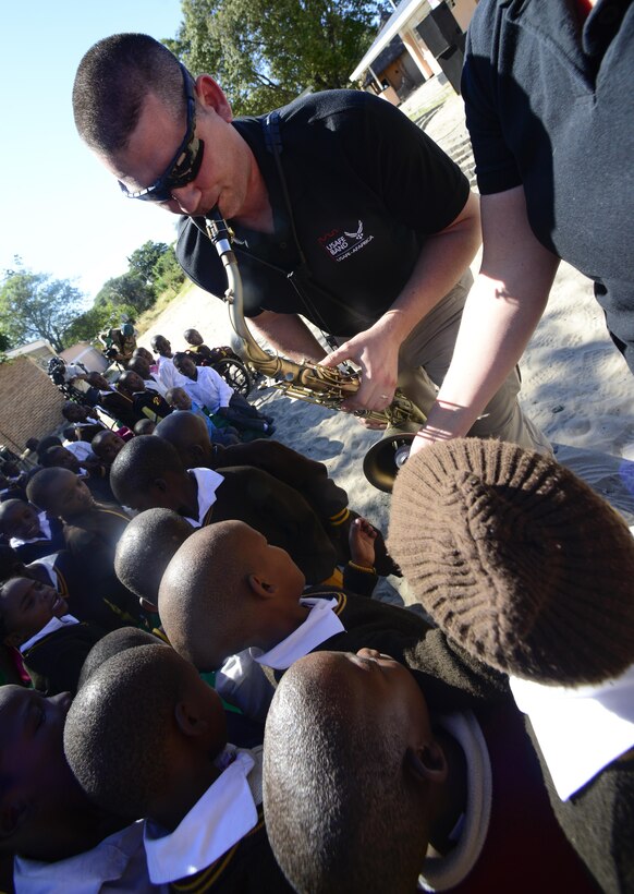 Tech. Sgt. John Dawson, U.S. Air Forces in Europe Band saxophonist, plays his instrument for students of the Kachikau Primary School in Kachikau, Botswana on May 17, 2017. The USAFE “Ambassadors Combo” performance Band partnered with the Botswana Defence Force Band while supporting the 2017 African Air Chiefs Symposium and performed for over five hundred students. The U.S. and Botswana have a strong relationship, and the U.S. military has a long and productive history of working with the Botswana Defence Force.  (U.S. Air Force photo by Staff Sgt. Krystal Ardrey)