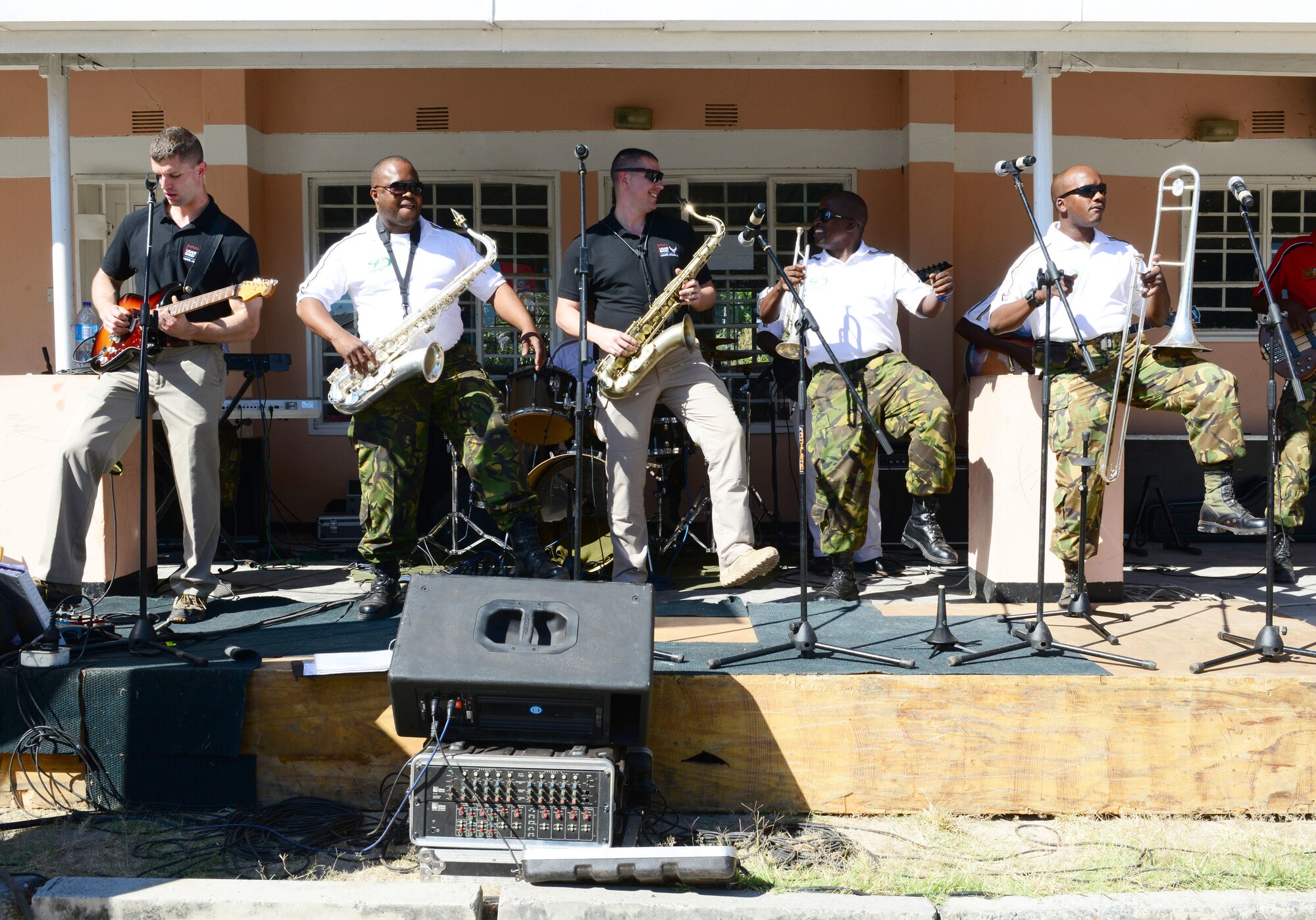 Members of the U.S. Air Forces in Europe “Ambassadors Combo” performance Band and Botswana Defence Force Band perform at the Kachikau Primary School in Kachikau, Botswana on May 17, 2017. While supporting the 2017 African Air Chiefs Symposium, bands conducted music workshops that focused on improvisation, rehearsal techniques, and synchronization. The bands learned to play two songs together and played for four primary and secondary schools in northern Botswana. (U.S. Air Force photo by Staff Sgt. Krystal Ardrey)