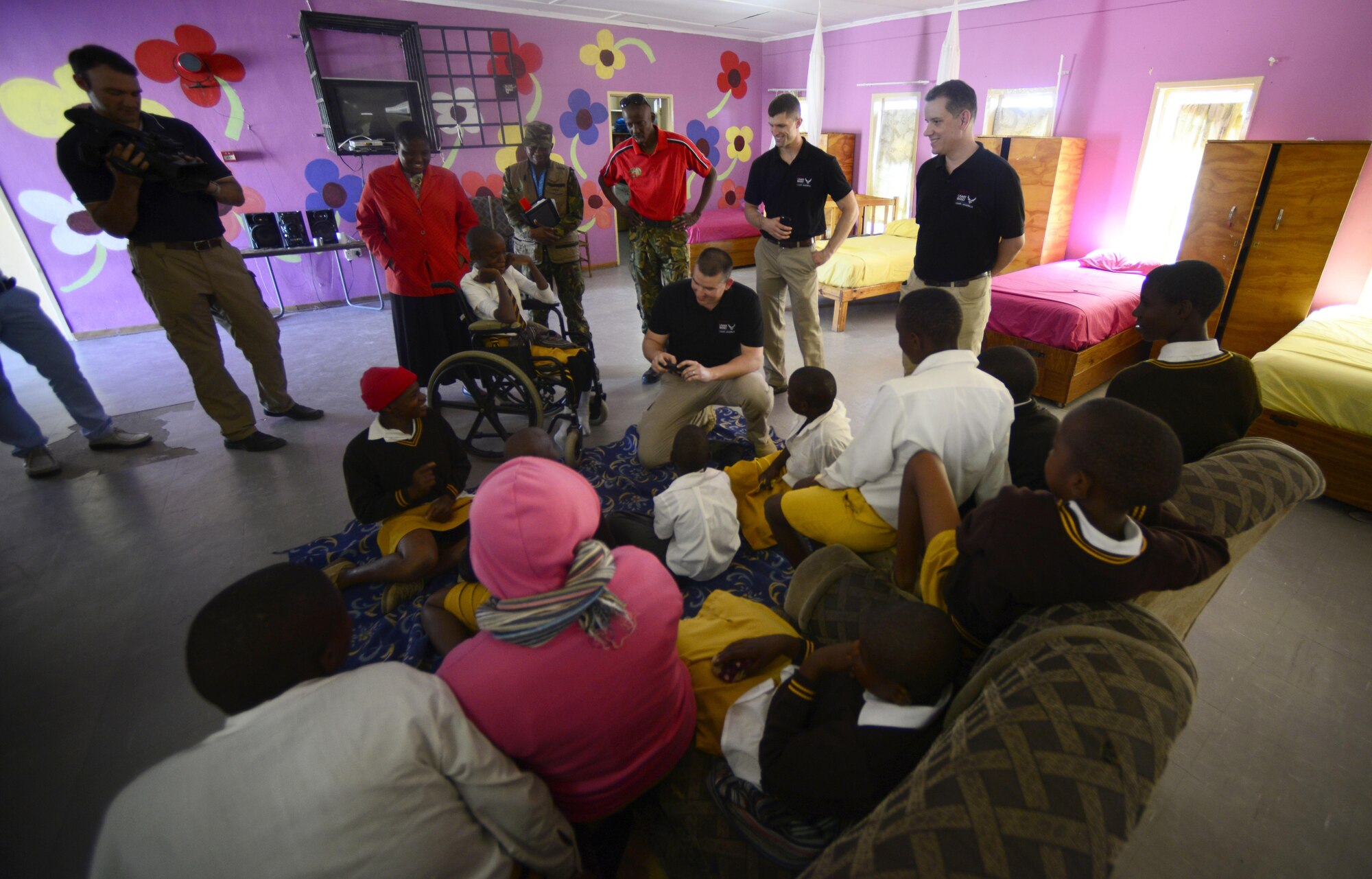 Members of the U.S. Air Forces in Europe “Ambassadors Combo” performance Band and Botswana Defence Force Band visit children at the Kachikau Primary School in Kachikau, Botswana on May 17, 2017. The bands performed a concert at Kachikau Primary School before bringing donations to and meeting with students in the special needs unit. Botswana and the U.S. are strong partners and engagements like these help to further strengthen the bonds between our two nations. (U.S. Air Force photo by Staff Sgt. Krystal Ardrey)