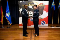 U.S. Air Force Senior Airman Madeline Ericson, 52nd Fighter Wing military justice paralegal, receives the John L. Levitow during the Pitsenbarger Airman Leadership School 17-D graduation at Club Eifel on Spangdahlem Air Base, Germany, May. 18, 2017. The Levitow award is the highest honor given to the student who displays excellence in all categories of ALS. (U.S. Air Force photo by Airman 1st Class Preston Cherry)