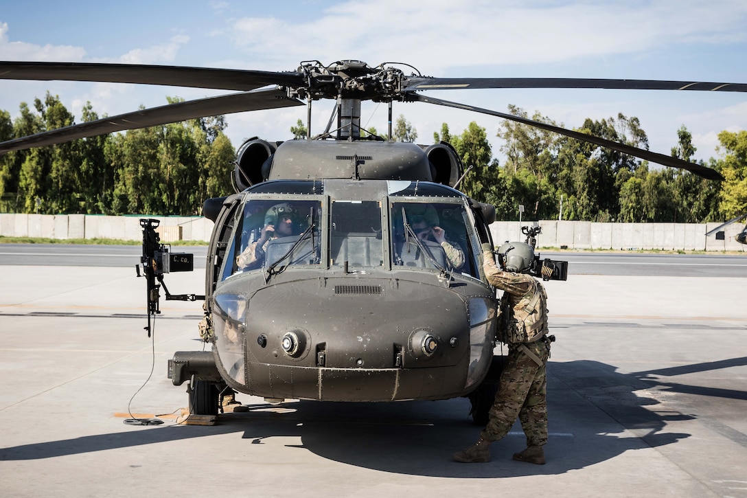 Army pilots perform a systems check inside a UH-60 Black Hawk helicopter to prepare for a mission at Operating Base Fenty, Jalalabad, Afghanistan, May 17, 2017. Army photo by Capt. Brian Harris
