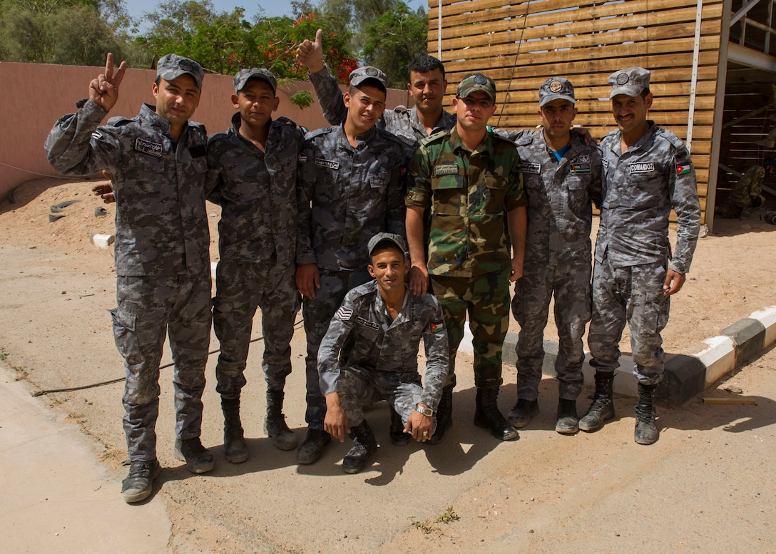 Members of the Royal Jordanian Navy pose for a photo after conducting training with the U.S. Coast Guard for Exercise Eager Lion 2017. Eager Lion is an annual U.S. Central Command exercise in Jordan designed to strengthen military-to- military relationships between the U.S., Jordan and other international partners. This year's iteration is comprised of about 7,200 military personnel from more than 20 nations that will respond to scenarios involving border security, command and control, cyber defense and battlespace management. (U.S. Navy Combat Camera photo by Mass Communication Specialist 2nd Class Austin L. Simmons)