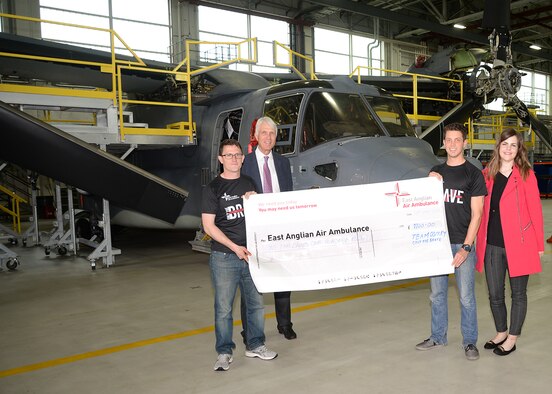 From left to right, U.S. Air Force Staff Sgt. Scott Walker, 352d Special Operations Maintenance Squadron crew chief; Patrick Peal, East Anglian Air Ambulance CEO; U.S. Air Force Tech. Sgt. Benjamin Glenn, 352d Special Operations Maintenance Group executive officer, and Fern Clark, EAAA fundraising officer, pose for a photograph with a check for £1,100 May 17, 2017, on RAF Mildenhall, England. Walker and Glenn were part of a five-man team – made up of four U.S. Air Force and one Royal Air Force members – who ran the EAAA “Only the Brave” mud obstacle course to raise money for the air ambulance charity. (U.S. Air Force photo by Karen Abeyasekere)