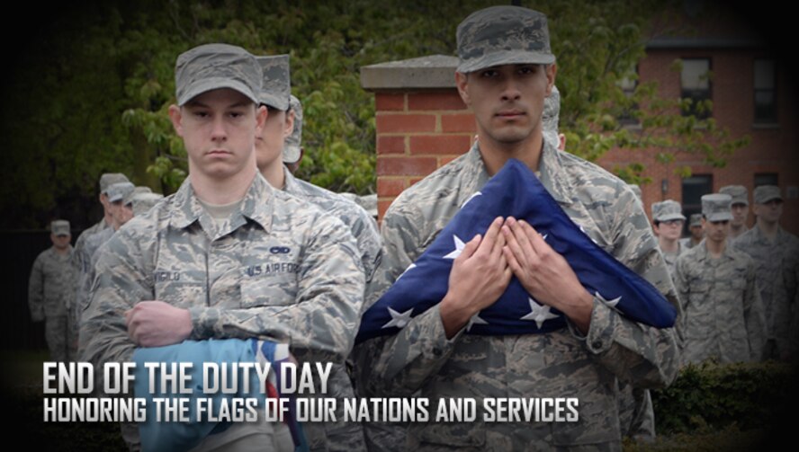 Airmen from the 488th Intelligence Squadron perform a retreat May 9, 2017, on RAF Mildenhall, England. Retreat is a long-standing tradition honoring the flag and signaling the end of the duty day. (U.S. Air Force photo by Karen Abeyasekere) 