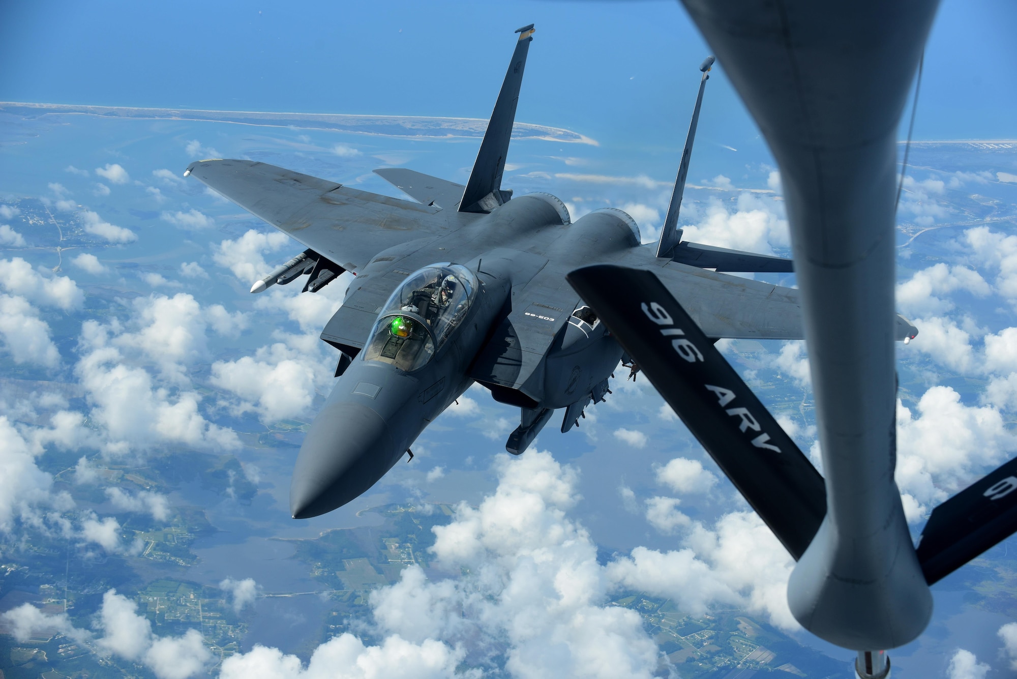 An F-15E Strike Eagle piloted by Col. Christopher Sage, 4th Fighter Wing commander, prepares to be refueled by a KC-135R Stratotanker, May 18, 2017, in the skies over Seymour Johnson Air Force Base, North Carolina. The boom is the fastest way to refuel aircraft at 1,200 gallons per minute. (U.S. Air Force photo by Airman 1st Class Kenneth Boyton)