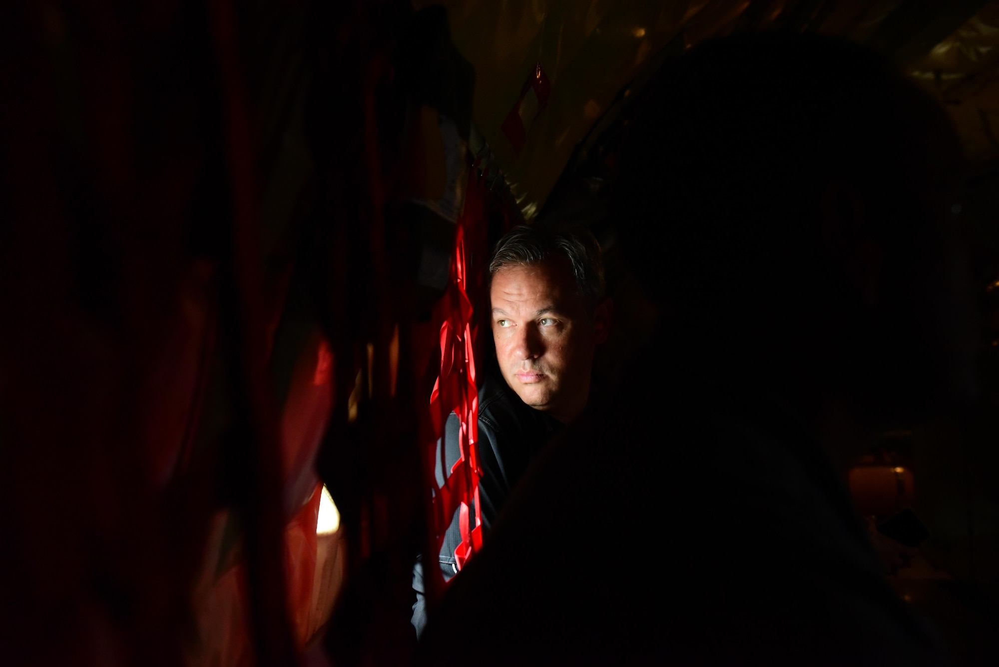 Dan Forest, North Carolina Lt. Governor, looks out of a window during a KC-135R Stratotanker incentive flight, May 18, 2017, in the skies over Seymour Johnson Air Force Base, North Carolina. Forest and other civic leaders received the flight before the Wings Over Wayne Air Show, a two-day free event scheduled for May 20-21, 2017. (U.S. Air Force photo by Airman 1st Class Kenneth Boyton)