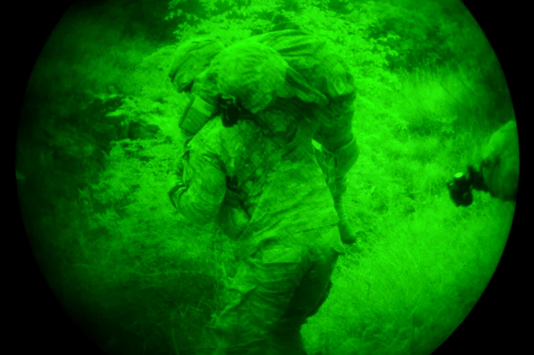 As seen through a night-vision lens, a U.S. soldier carries a mock casualty to a medical collection point during Bayonet-Minotaur Exercise 2017 in Thessaloniki, Greece, May 17, 2017. Army photo by Graigg Faggionato