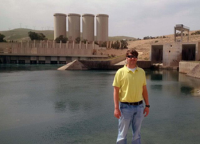 Huntsville Center’s Chad Braun poses in front of Iraq’s Mosul Dam in this undated photo. While Iraqi forces fight to take back the city of Mosul just 30 miles away, Braun labors with fellow U.S. Army Corps of Engineers’ teammates, contractors and others to prevent a dam failure with the potential for catastrophic consequences on a massive scale.