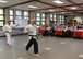 Lloyd Corricelli, right, and Mark Flanders perform a martial arts demonstration during an Asian American and Pacific Islander Heritage Month food-tasting event at the base chapel May 15. AAPIHM committee members and volunteers served Asian cuisine and held the demonstration to celebrate the monthlong observance. (U.S. Air Force photo by Linda LaBonte Britt)