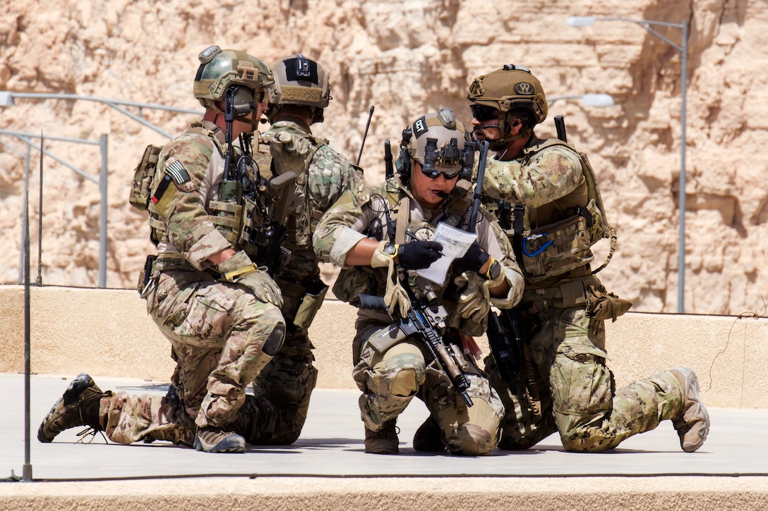 U.S. airmen and an Italian Special Operations Wing member secure a rooftop at the King Abdullah II Special Operations Training Center during Eager Lion 2017 in Amman, Jordan, May 11, 2017. Navy photo by Petty Officer 2nd Class Christopher Lange