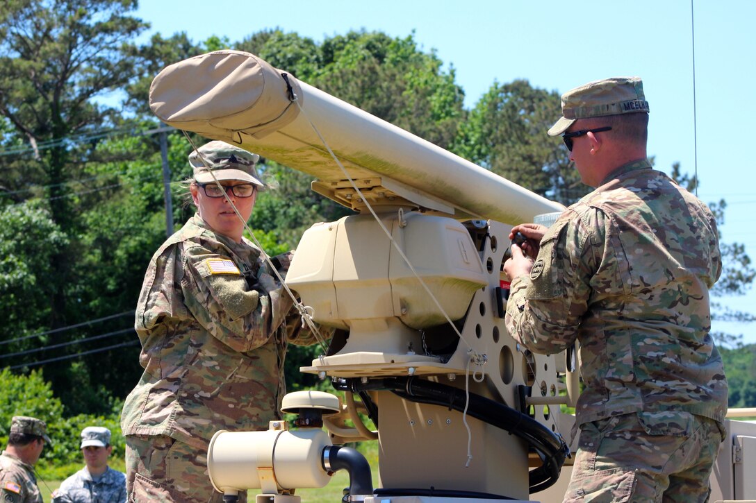 Sgt. Sasha Durnal and Spc. Ryan Mcelaney, both assigned to the 338th Transportation Detachment (Harbormaster) , adjust radar equipment on the Harbormaster Command and Control Center at Joint Expeditionary Base Little Creek-Fort Story, Virginia Beach, Va. May 14, 2017. The Soldiers traveled to the area along with nearly 450 U.S. Army Reserve Soldiers for Big Logistics Over the Shore (Big LOTS) East 2017, a U.S. Army Reserve exercise that provides hands-on training for boat units, terminal battalions, and deployment support command units to sharpen critical tasks that support bare beach operations.  (U.S. Army Reserve Photo by 1st Sgt. Angele Ringo)